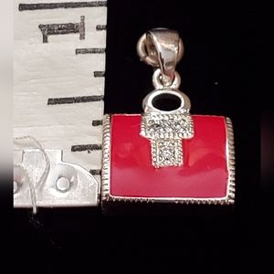 Sterling Silver Charm, Inlaid Red Enamel and Studded with Diamond-like stones.